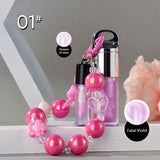 Two-piece Set Of Color-changing Lip Oils And A Bow-shaped Pearl Bracelet Charm.