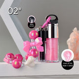 Two-piece Set Of Color-changing Lip Oils And A Bow-shaped Pearl Bracelet Charm.