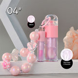 Two-piece Set Of Color-changing Lip Oils And A Bow-shaped Pearl Bracelet Charm.